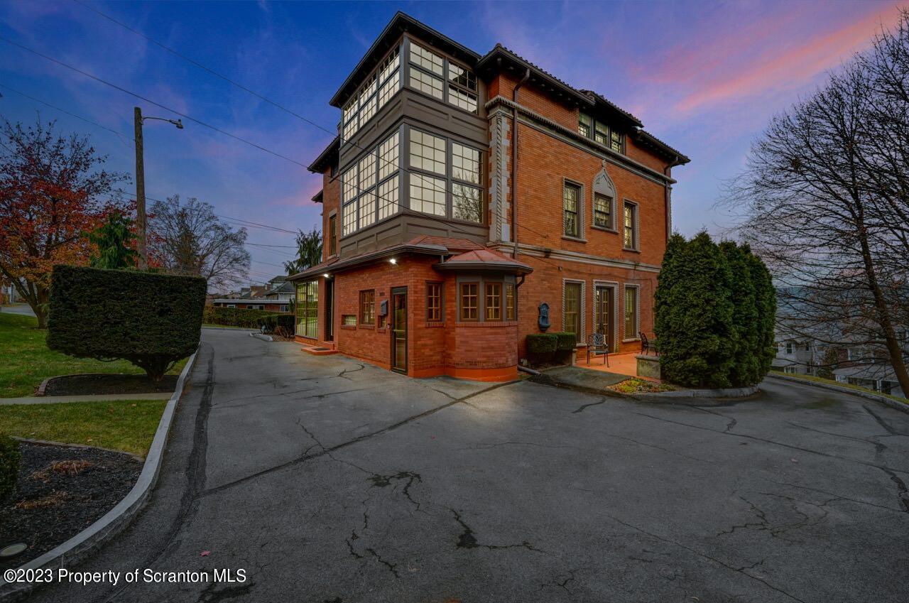 1000 Clay Avenue Scranton, PA 18510 - Photo 6 of 90 a front view of a house with a garden
