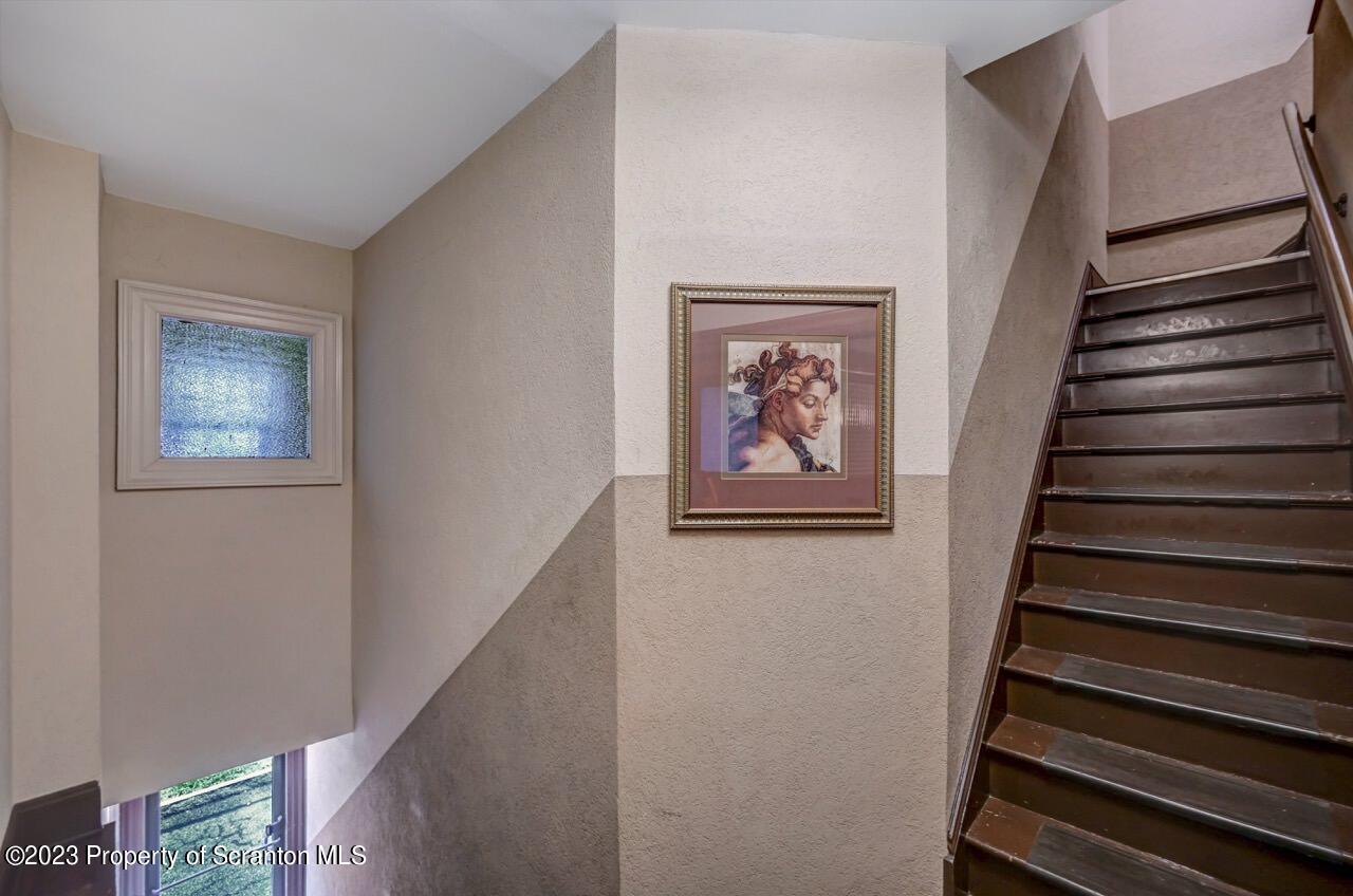 1000 Clay Avenue Scranton, PA 18510 - Photo 62 of 90 a view of staircase with wooden floor and white walls