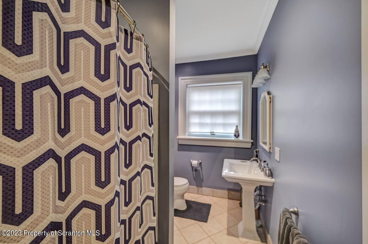 1000 Clay Avenue Scranton, PA 18510 - Photo 66 of 90 a bathroom with a sink and a mirror