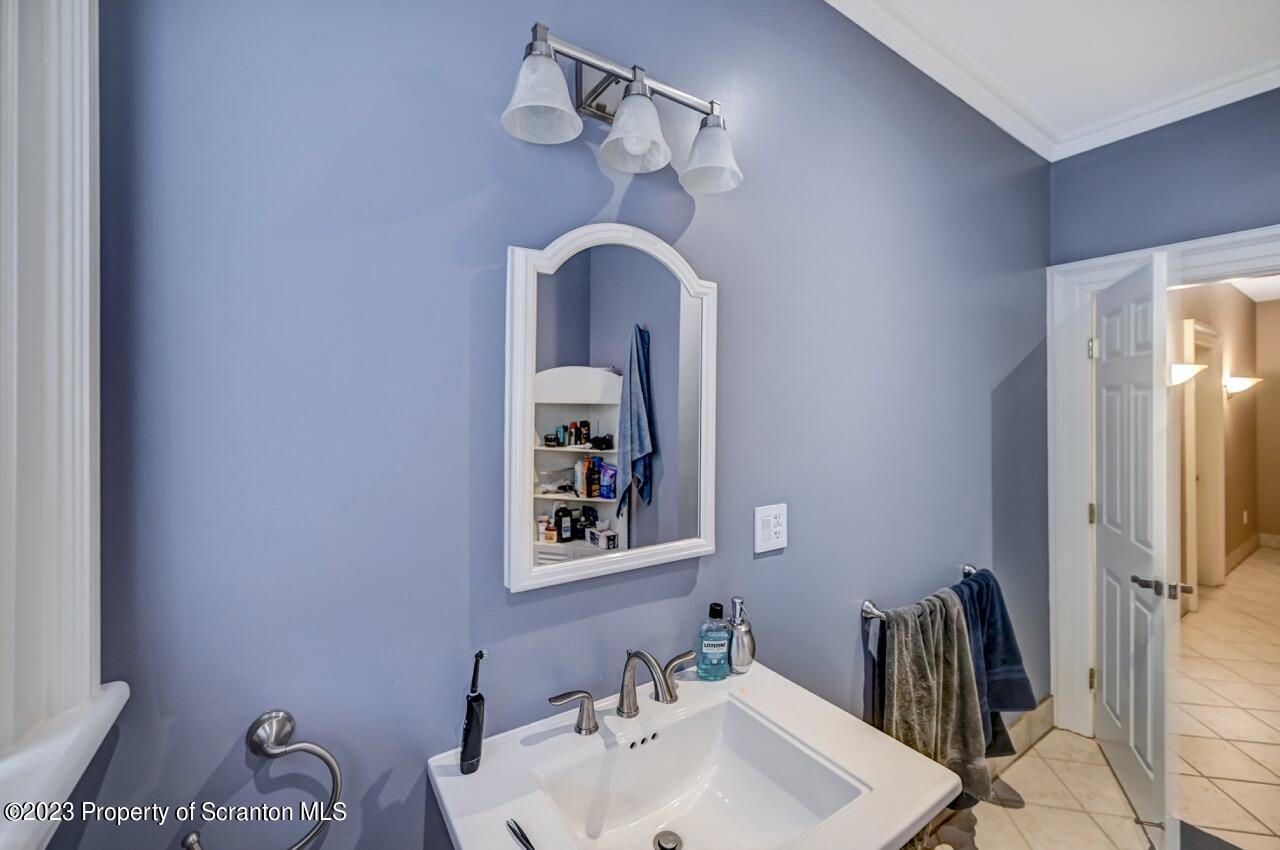 1000 Clay Avenue Scranton, PA 18510 - Photo 67 of 90 a bathroom with a sink and a mirror
