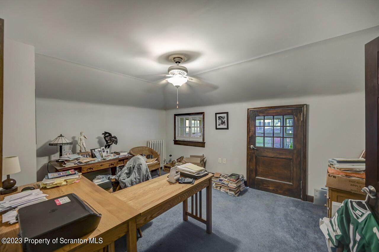 1000 Clay Avenue Scranton, PA 18510 - Photo 69 of 90 a living room with furniture a chandelier a piano and a window