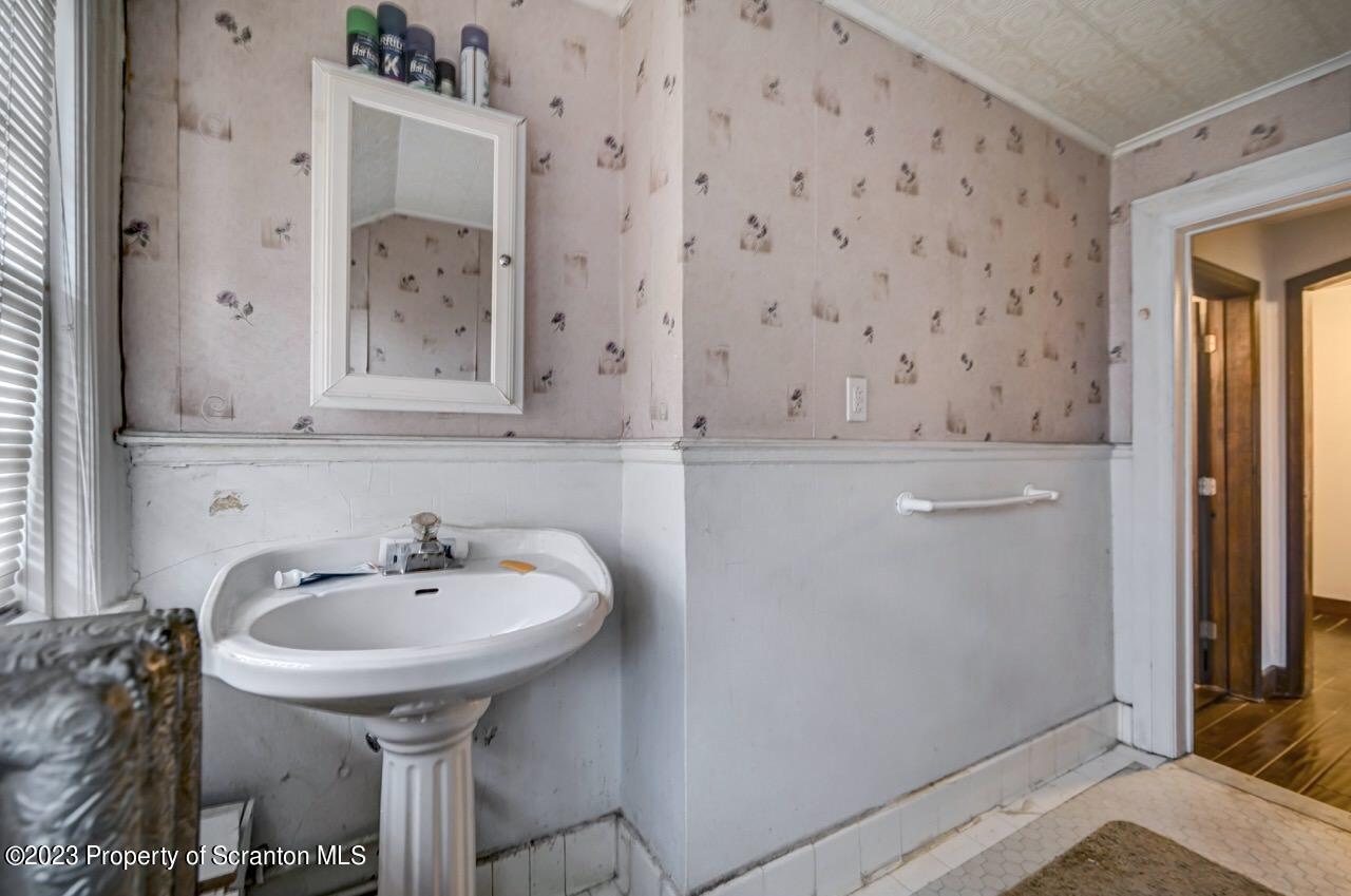 1000 Clay Avenue Scranton, PA 18510 - Photo 76 of 90 a bathroom with a sink and mirror
