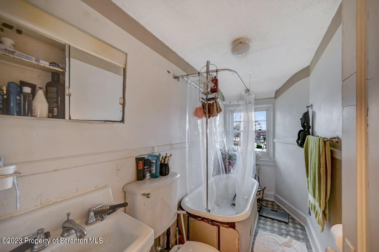 1000 Clay Avenue Scranton, PA 18510 - Photo 79 of 90 a bathroom with a sink and mirror with bathtub