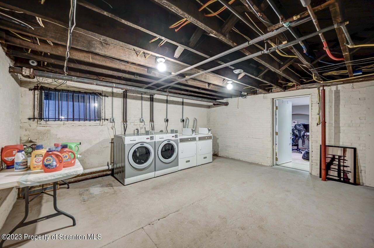 1000 Clay Avenue Scranton, PA 18510 - Photo 84 of 90 a utility room with dryer washer and stair