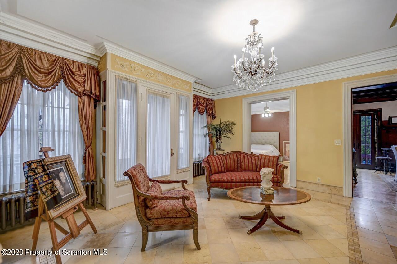 1000 Clay Avenue Scranton, PA 18510 - Photo 10 of 90 a living room with furniture and a chandelier