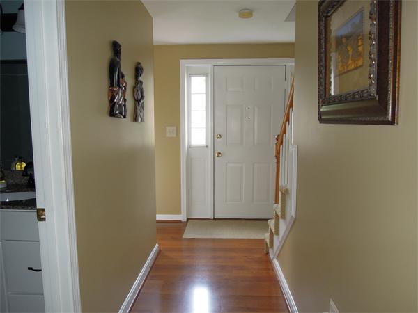 76 Stonegate Road, Unit 76 Chelmsford, MA 01824 - Photo 8 of 23 a view of a hallway with wooden floor and closet