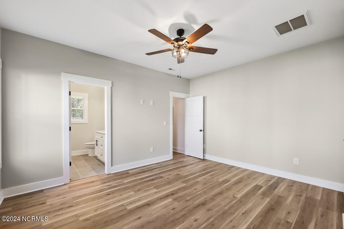 702 Boundary Loop Road Northwest Calabash, NC 28467 - Photo 10 of 23 702 primary bedroom with private bath