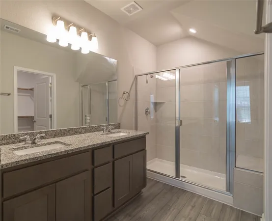 a bathroom with a sink and mirror