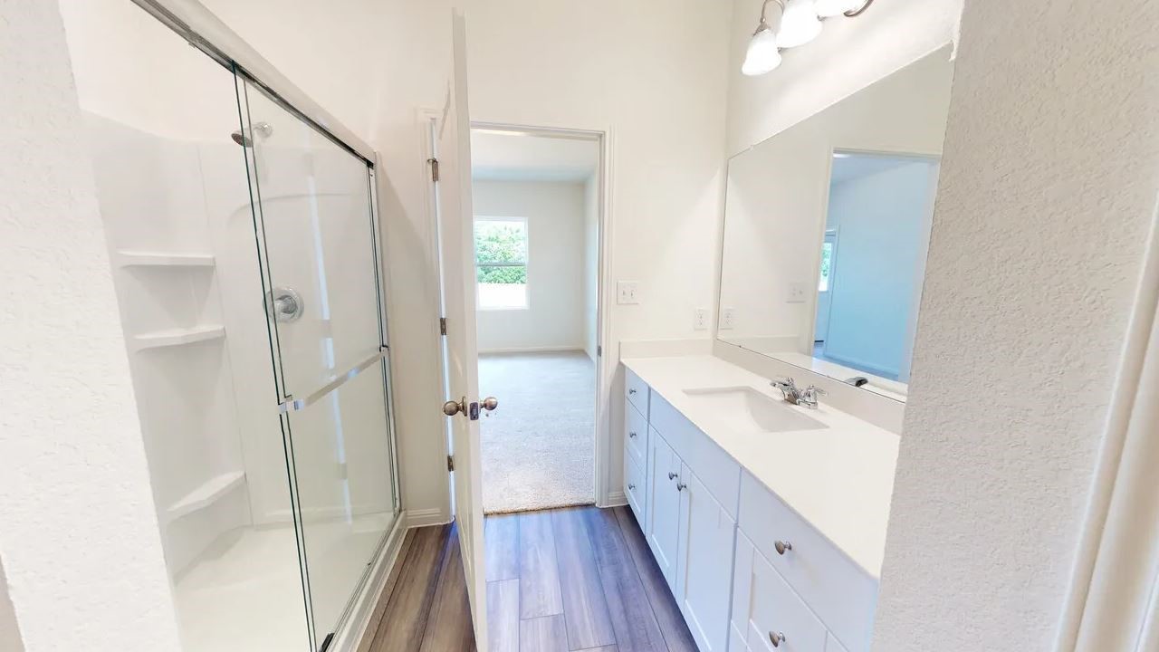 415 Cliff Drive Maxwell, TX 78656 - Photo 5 of 7 a bathroom with a double vanity sink toilet and shower