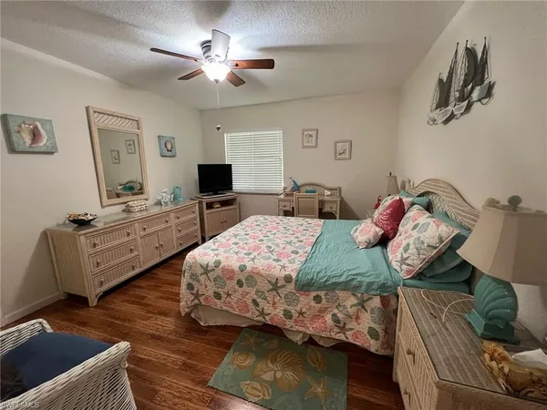 a bedroom with a bed and furniture