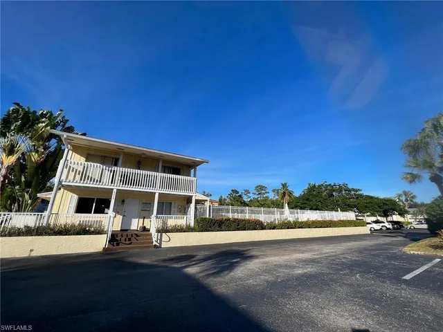 a view of street with parked cars