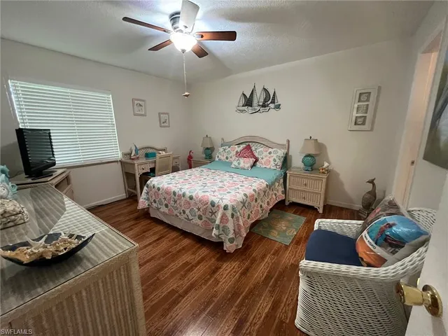 a bedroom with bed and a window