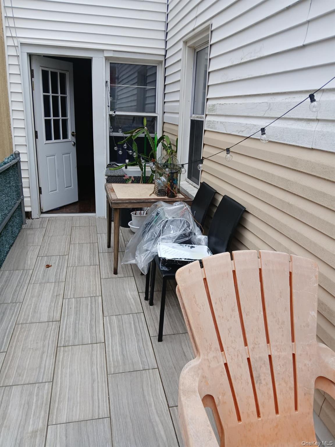 88-10 78th Street Queens, NY 11421 - Photo 12 of 12 Wooden terrace with grilling area