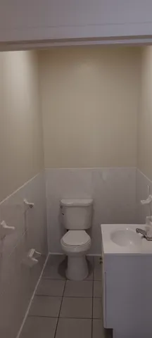 a bathroom with a toilet and a sink