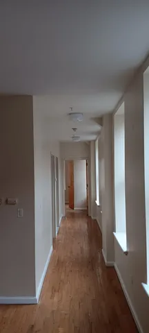 a view of a hallway with a livingroom