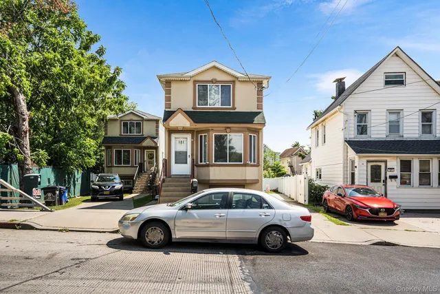 a car parked in front of a house