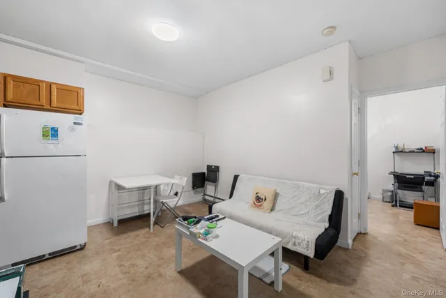 a reading room with furniture and wooden floor