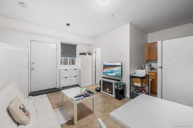 a bedroom with furniture and a fireplace