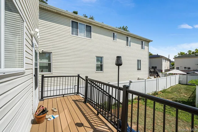 a view of a house with wooden deck