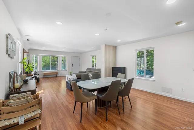 a view of a dining room with furniture window and outside view
