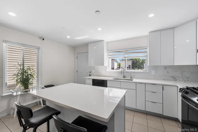 a kitchen with a stove a sink and a refrigerator