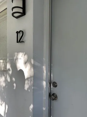 a bathroom with a sink mirror and vanity