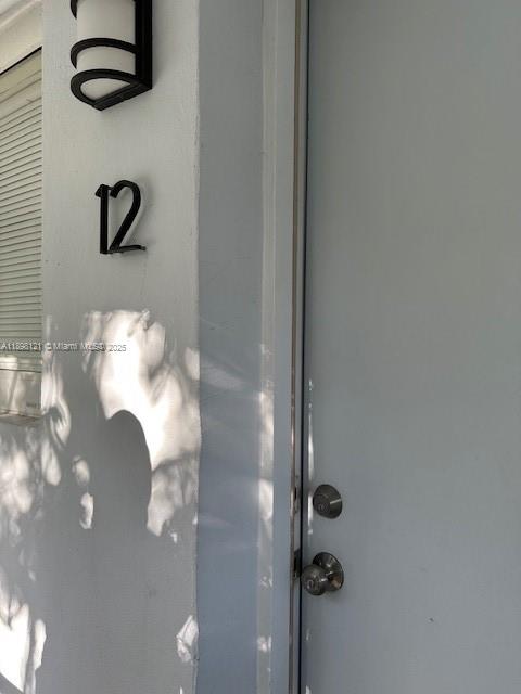 a bathroom with a sink mirror and vanity