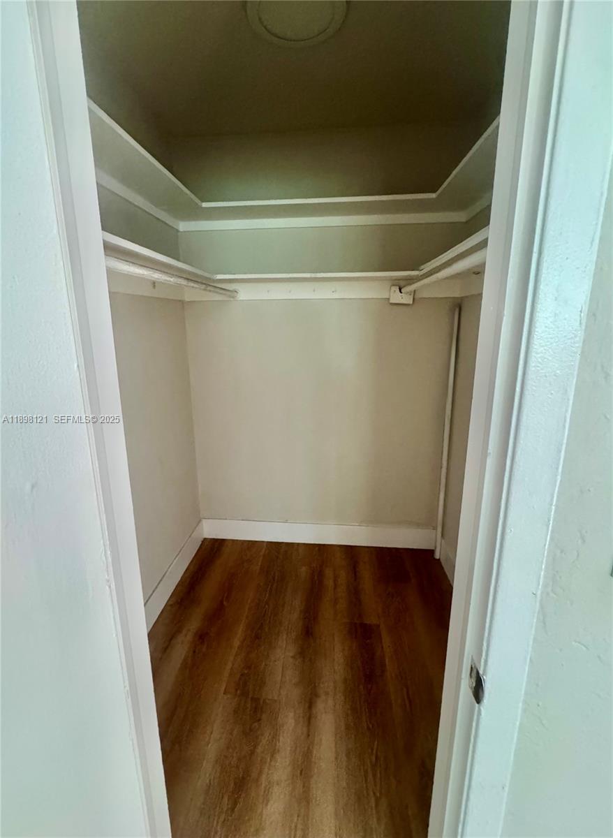 6805 Southwest 88th Street, Unit 12 Pinecrest, FL 33156 - Photo 12 of 18 a view of an empty room