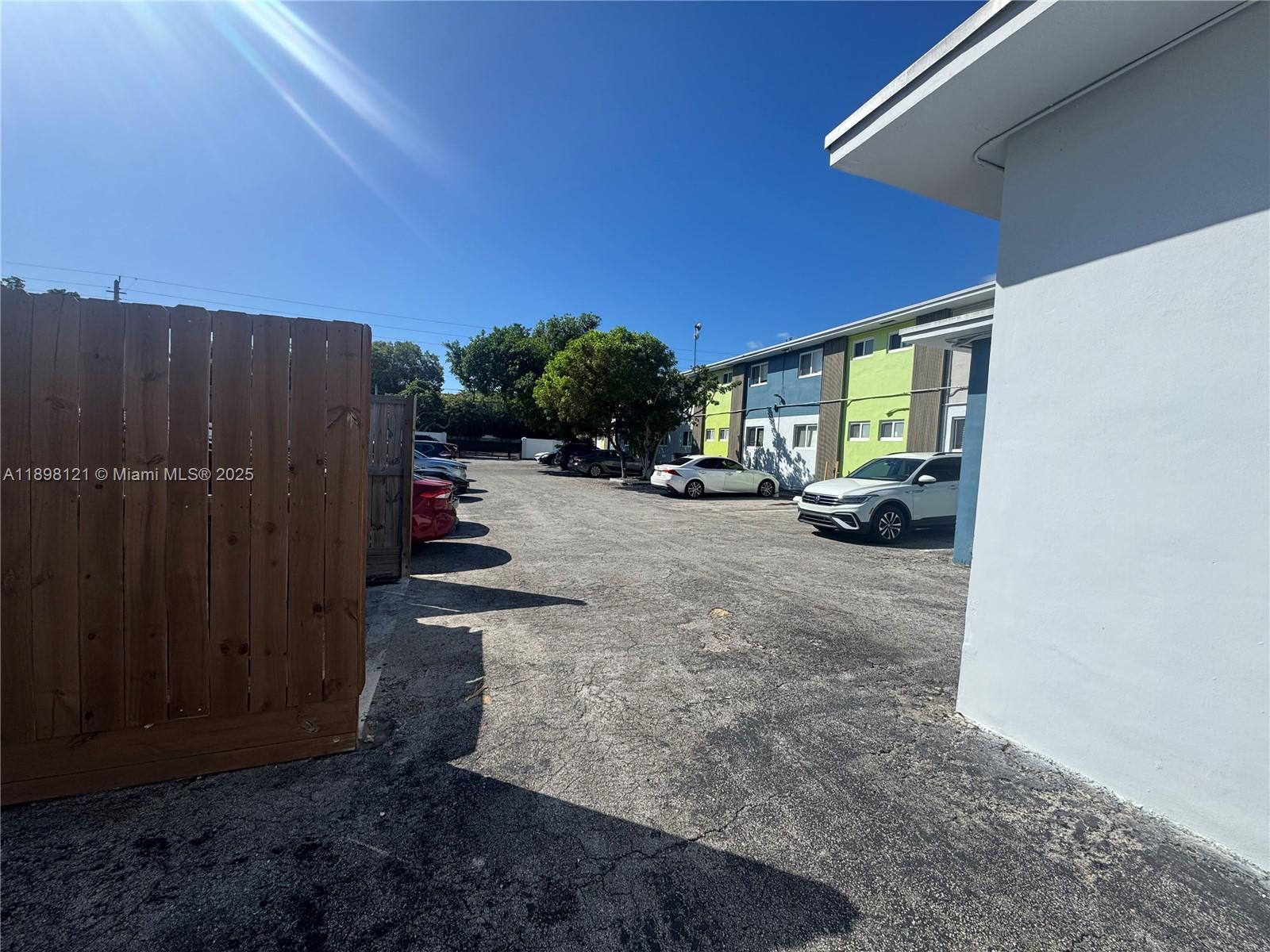 6805 Southwest 88th Street, Unit 12 Pinecrest, FL 33156 - Photo 17 of 18 a view of a street with cars on road