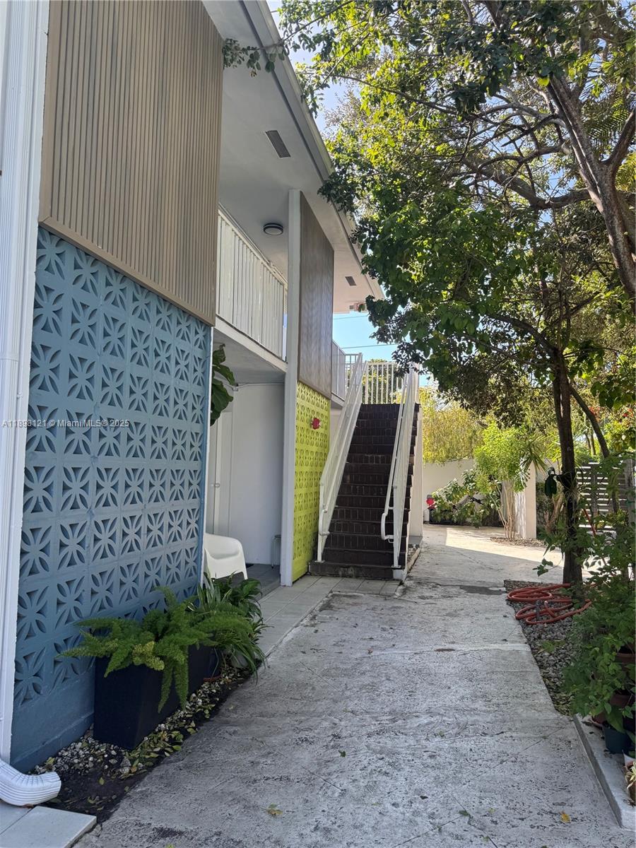 6805 Southwest 88th Street, Unit 12 Pinecrest, FL 33156 - Photo 3 of 18 a view of outdoor space and yard