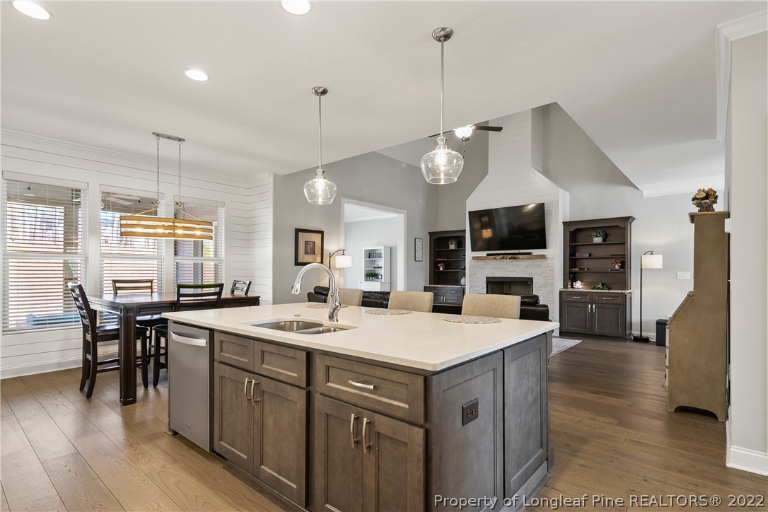46 Brookhill Court Spring Lake, NC 28390 - Photo 16 of 50 a large kitchen with kitchen island a large island in the center a sink a stove and a center island