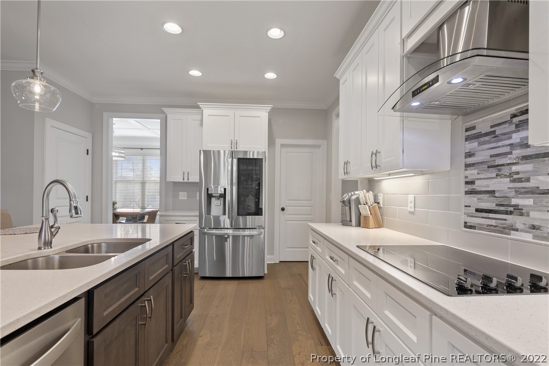 46 Brookhill Court Spring Lake, NC 28390 - Photo 18 of 50 a large kitchen with stainless steel appliances granite countertop a sink and cabinets
