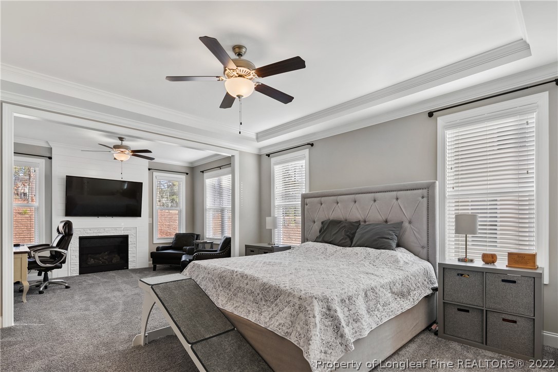 46 Brookhill Court Spring Lake, NC 28390 - Photo 21 of 50 a bedroom with a large bed and a flat screen tv