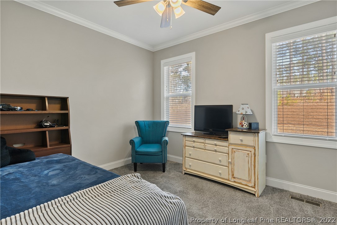 46 Brookhill Court Spring Lake, NC 28390 - Photo 29 of 50 a room with a bed and a television