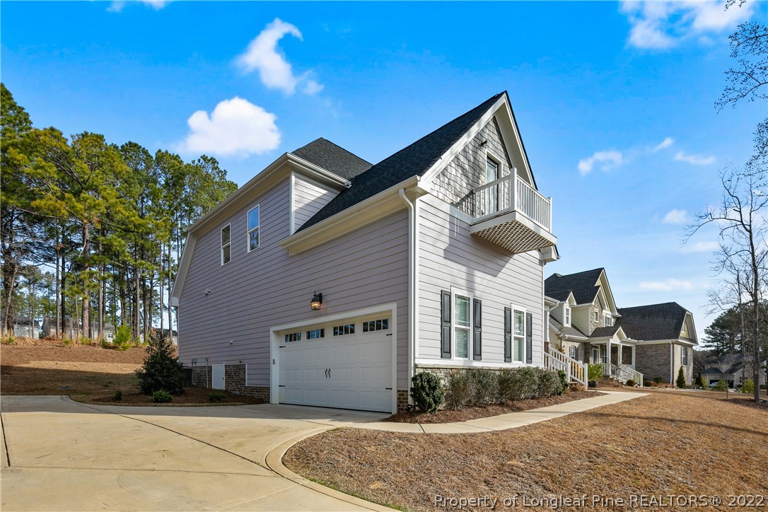 46 Brookhill Court Spring Lake, NC 28390 - Photo 3 of 50 a front view of a house with a yard