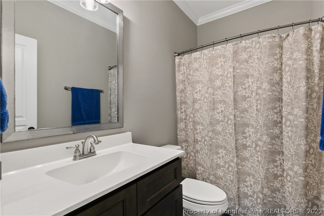 46 Brookhill Court Spring Lake, NC 28390 - Photo 31 of 50 a bathroom with a sink and a toilet