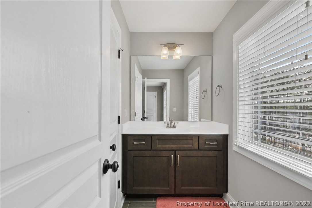 46 Brookhill Court Spring Lake, NC 28390 - Photo 37 of 50 a bathroom with a sink and a mirror