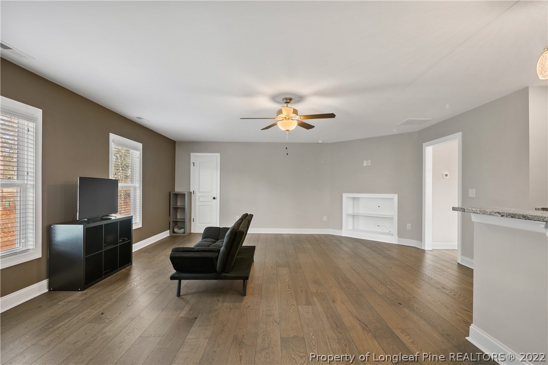 46 Brookhill Court Spring Lake, NC 28390 - Photo 44 of 50 a living room with furniture and a flat screen tv