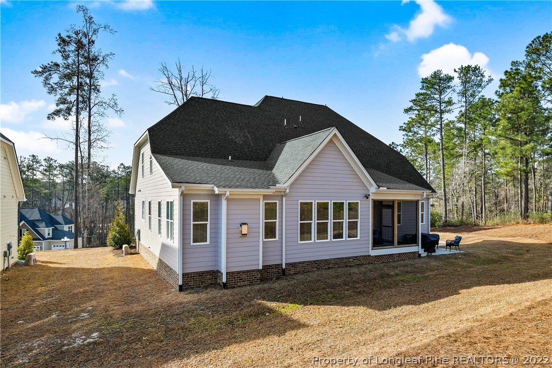 46 Brookhill Court Spring Lake, NC 28390 - Photo 48 of 50 a front view of a house with a yard