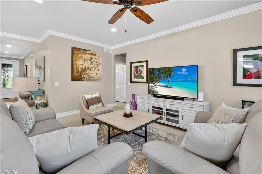 5215 Ciatto Way Ave Maria, FL 34142 - Photo 13 of 46 a living room with furniture and a flat screen tv