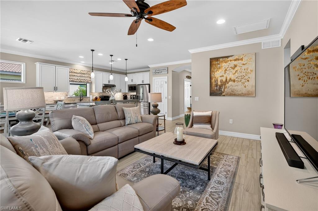 5215 Ciatto Way Ave Maria, FL 34142 - Photo 14 of 46 a living room with furniture and a large window