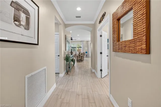 a kitchen with stainless steel appliances granite countertop a refrigerator sink and stove