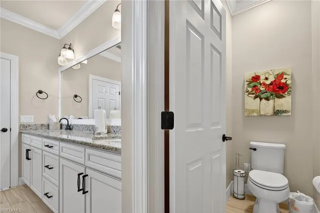 a view of a hallway with closet and wooden floor