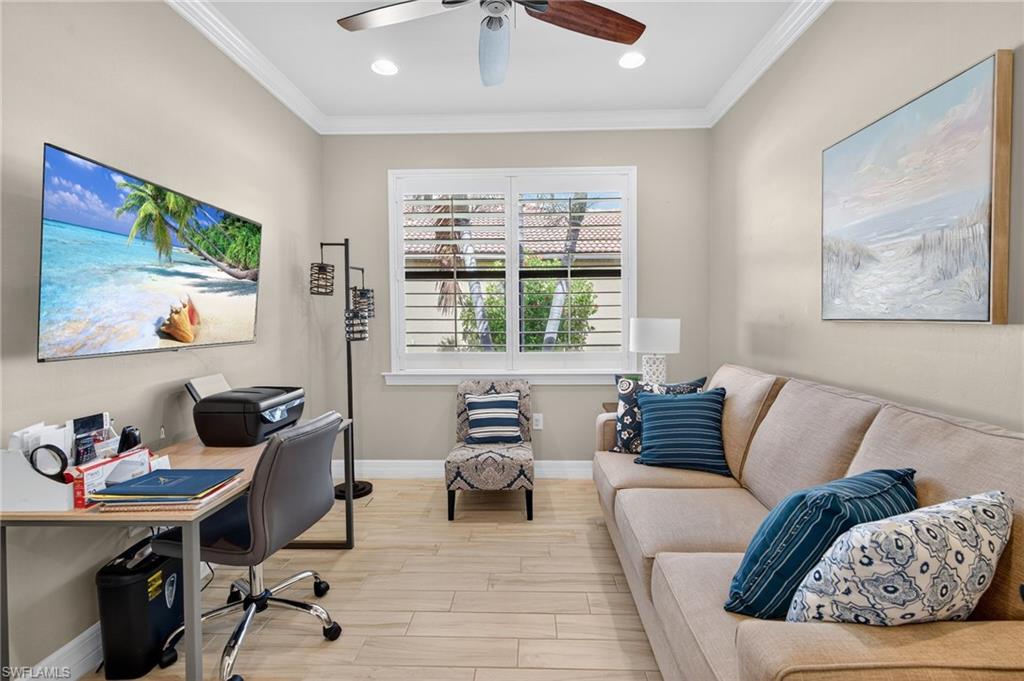 5215 Ciatto Way Ave Maria, FL 34142 - Photo 25 of 46 a living room with furniture and a window