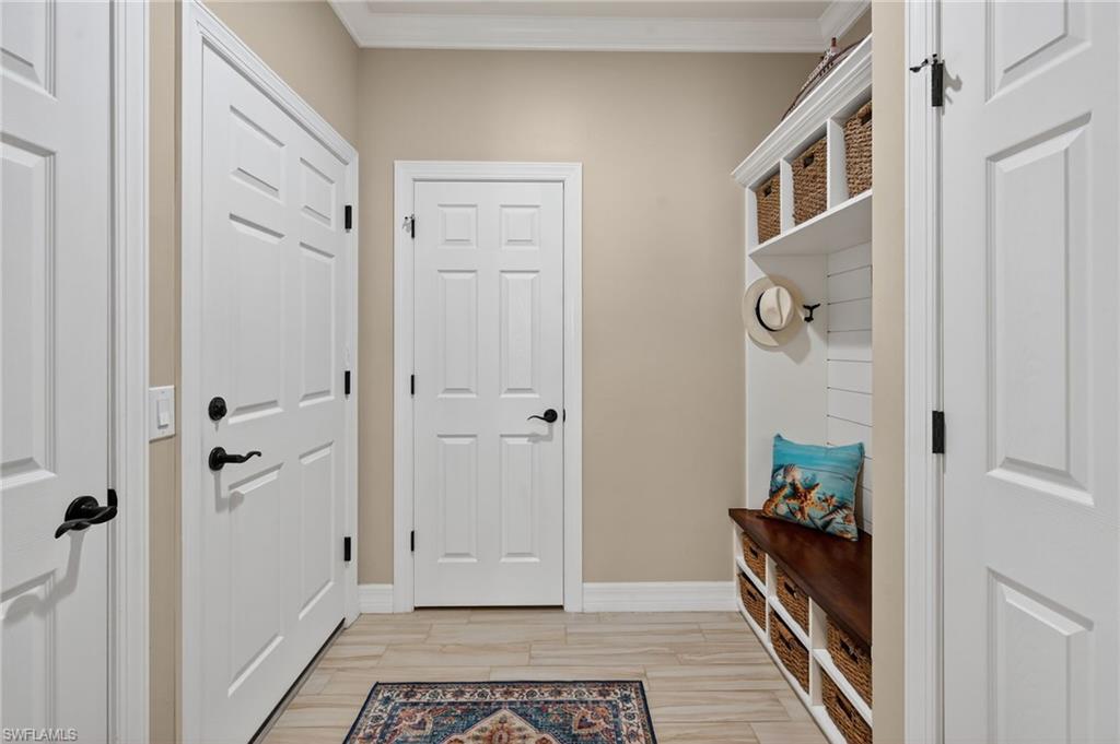 5215 Ciatto Way Ave Maria, FL 34142 - Photo 26 of 46 a view of a hallway with closet and wooden floor
