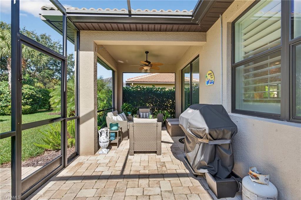 5215 Ciatto Way Ave Maria, FL 34142 - Photo 29 of 46 a living room with large windows