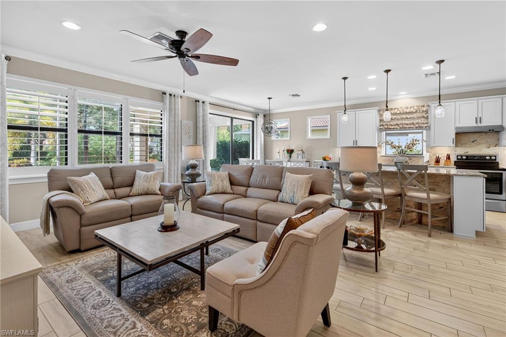 5215 Ciatto Way Ave Maria, FL 34142 - Photo 3 of 46 a living room with furniture ceiling fan and a window