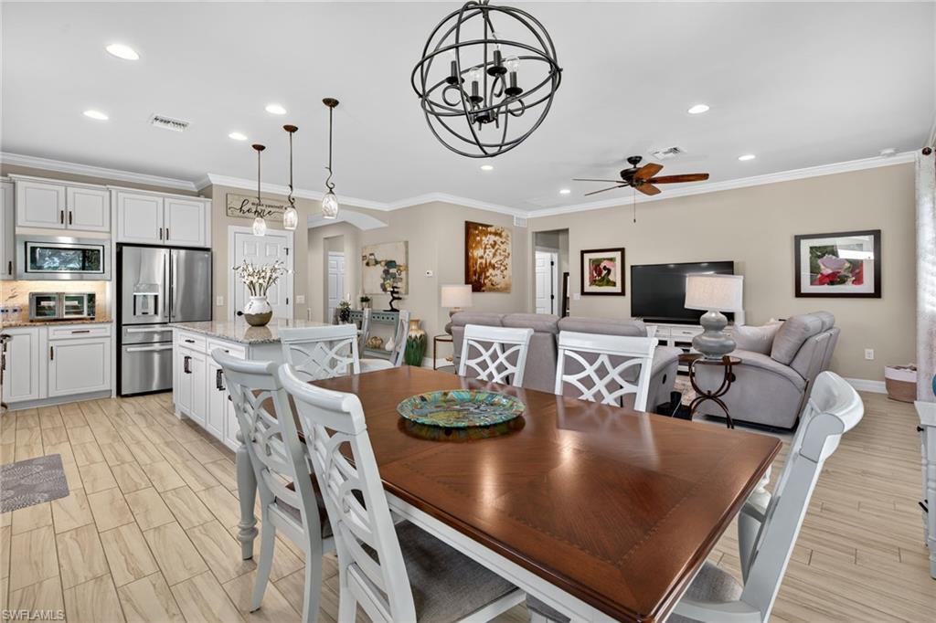 5215 Ciatto Way Ave Maria, FL 34142 - Photo 5 of 46 a large kitchen with a table and chairs