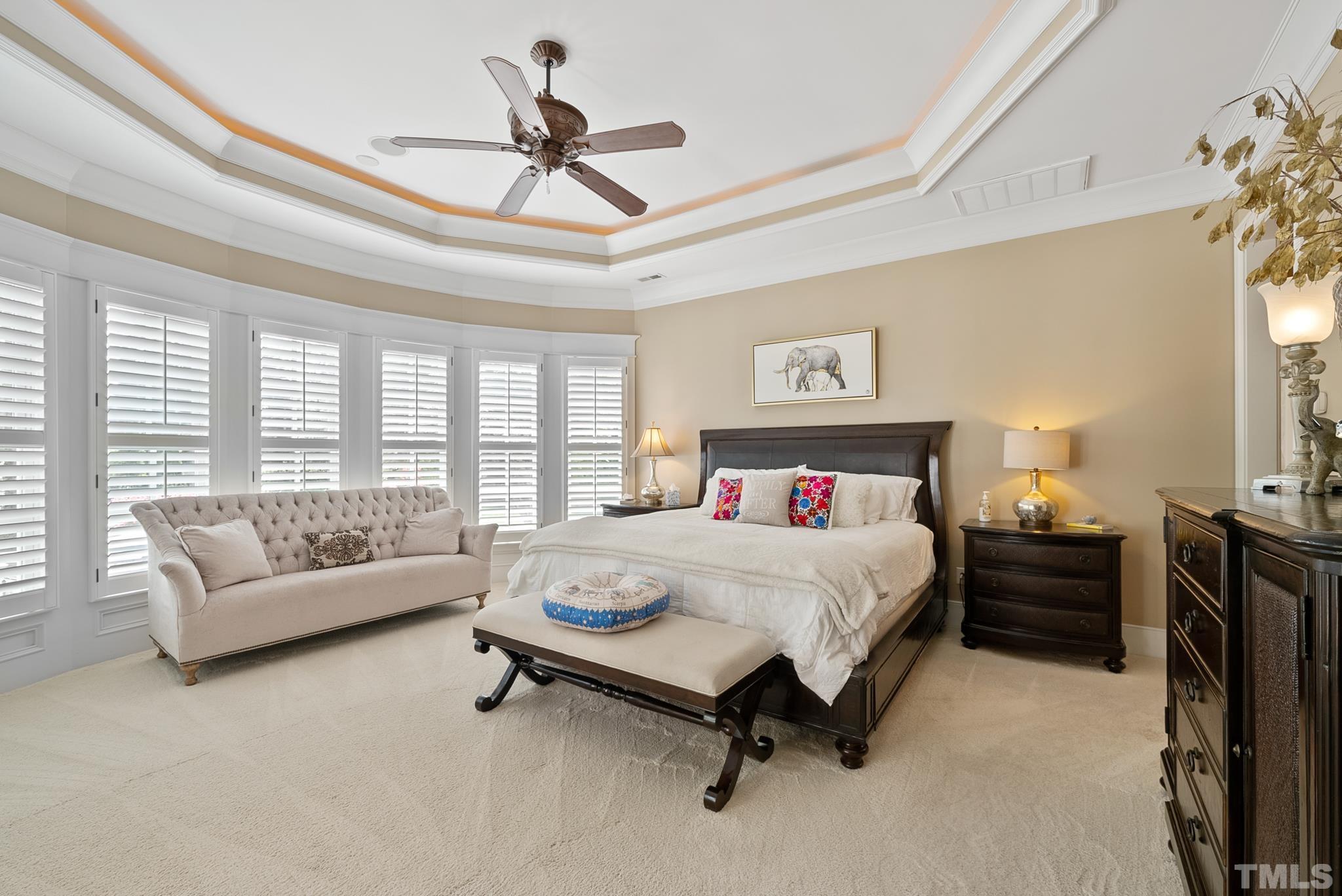 1204 Hedgelawn Way Raleigh, NC 27615 - Photo 20 of 44 a bedroom with a bed and a couch