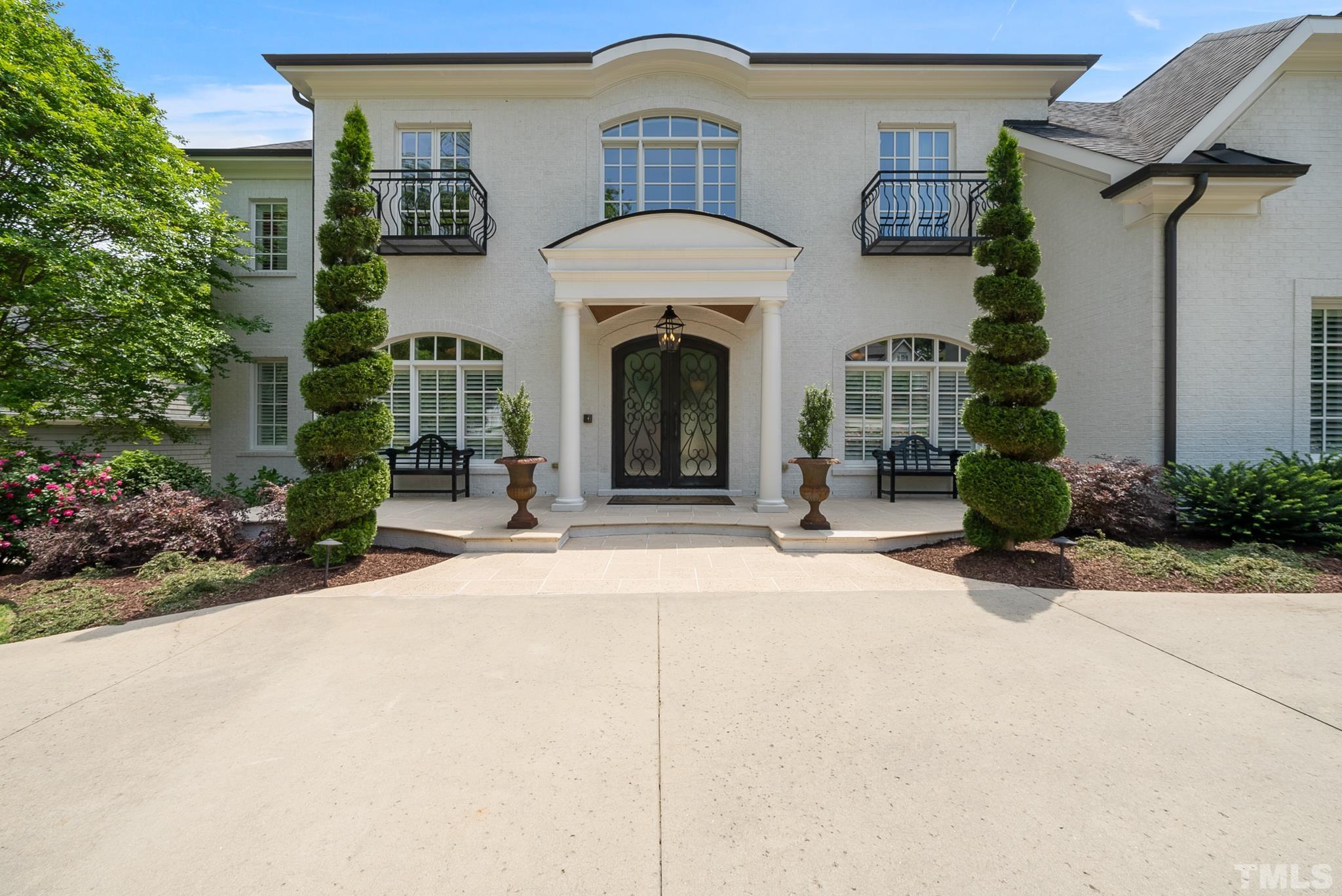 1204 Hedgelawn Way Raleigh, NC 27615 - Photo 2 of 44 a front view of a house with a garden